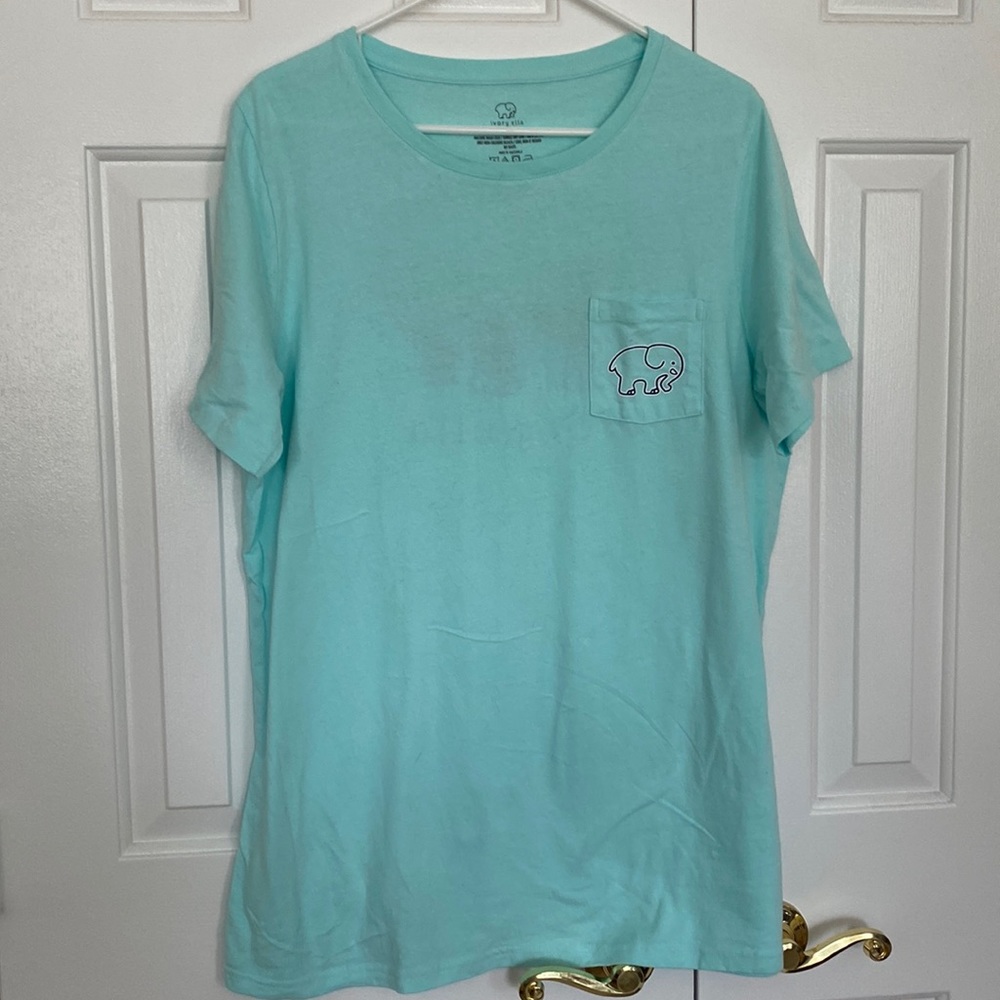 Teal Ivory Ella tee with sunset elephant on the back.